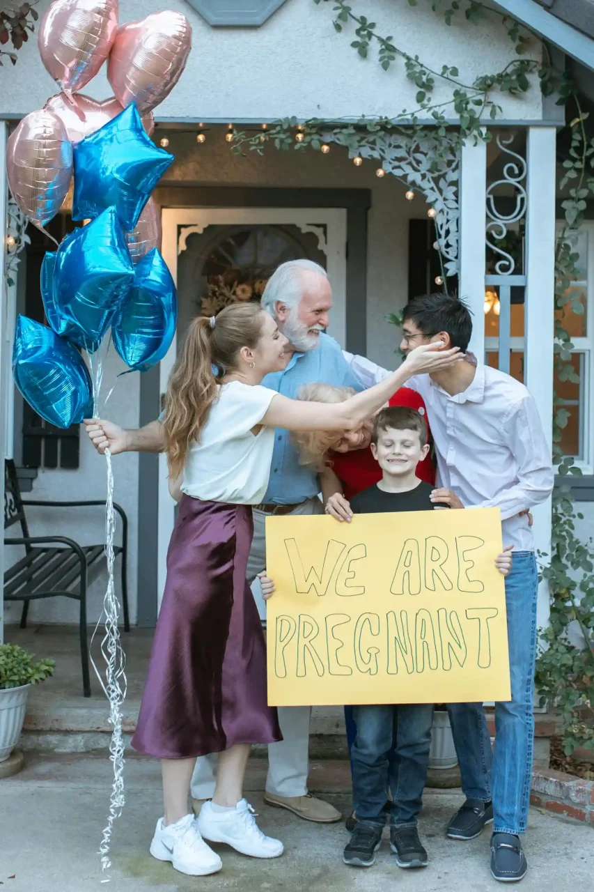 family celebrating new pregnancy